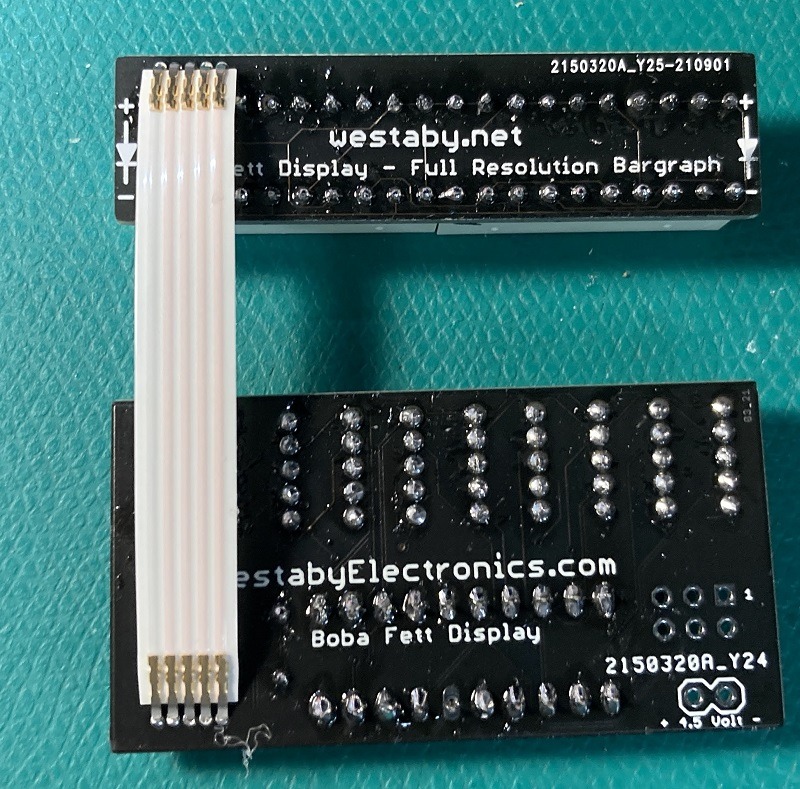 Hot glue strain relief applied near ribbon cable solder joints