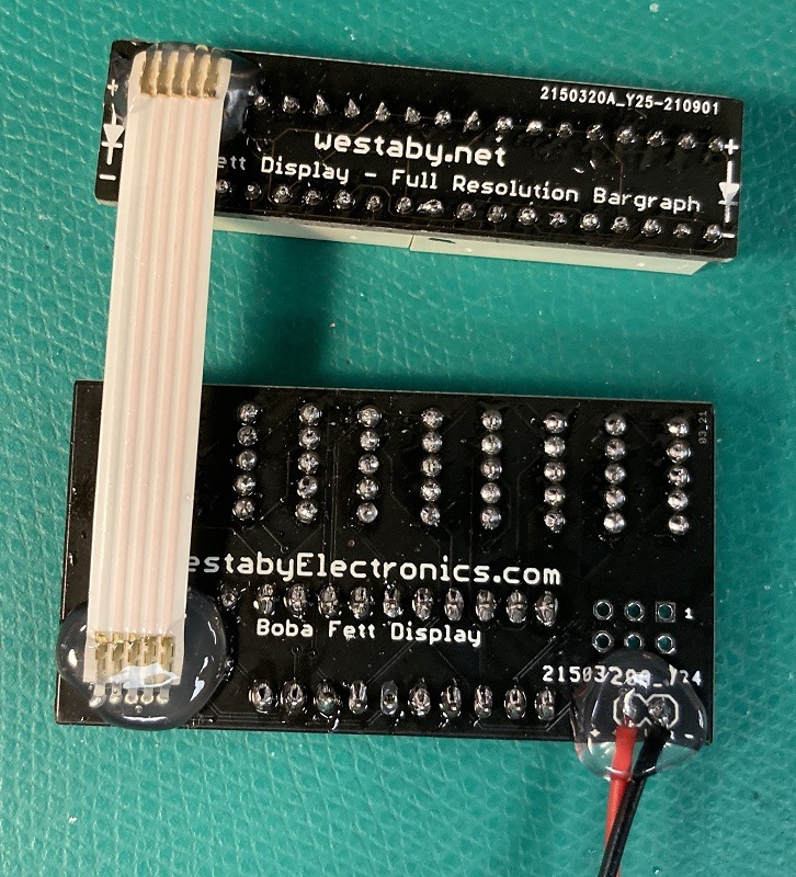 Ribbon cable with hot glue strain relief on both sides